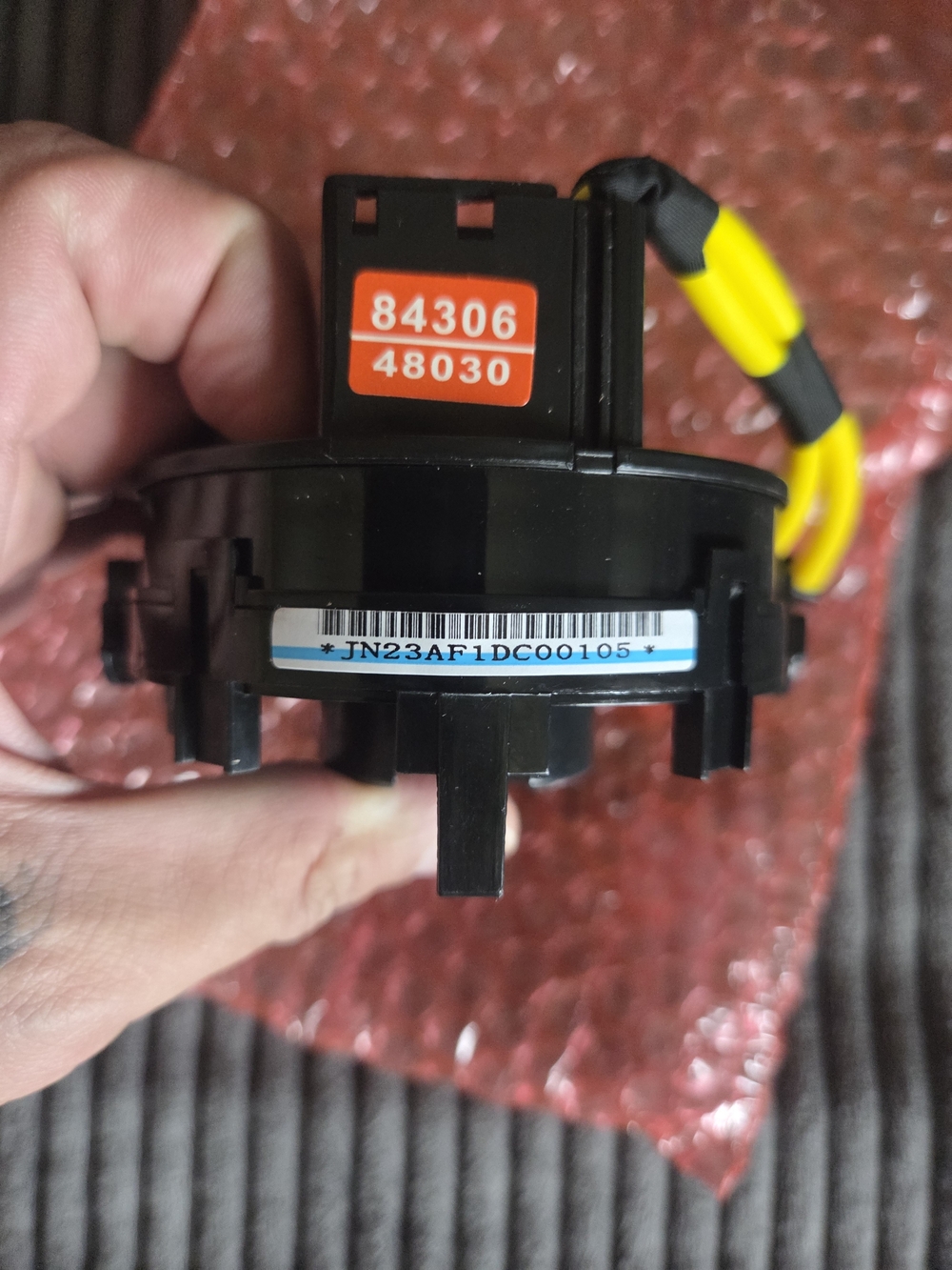 Black Automotive Clock Spring with Yellow Wiring